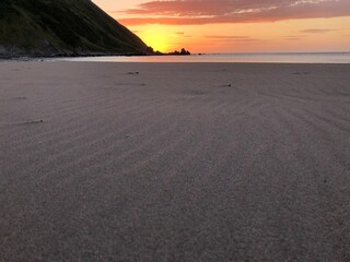 Patterns on sand on Scottish beach at sunset