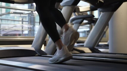 sportsman running on fitness treadmill in gym. Treadmill workout of sportsman. Fitness gym equipment - Powered by Adobe