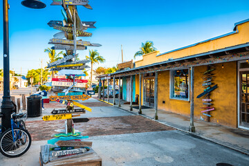 Key West distance marker and colorful street view