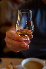 Tasting of single malt scotch whisky in whiskey bar in Edinburgh, UK