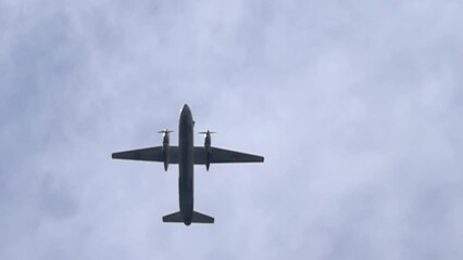 Flying twin -engine propeller liner. Super slow motion 1000 fps