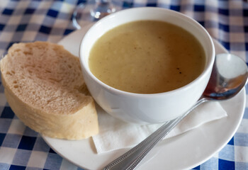 Traditional scottish vegetarian food, potato soup with leek, served in oldest gastro-pub of Edinburgh, Scotland