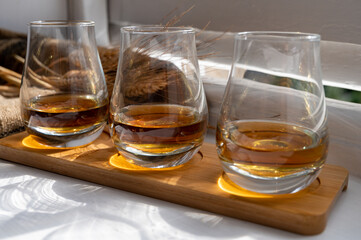 Flight of single malt scotch whisky served on old wooden window sill in Scottisch house in Edinburgh, Scotland, UK