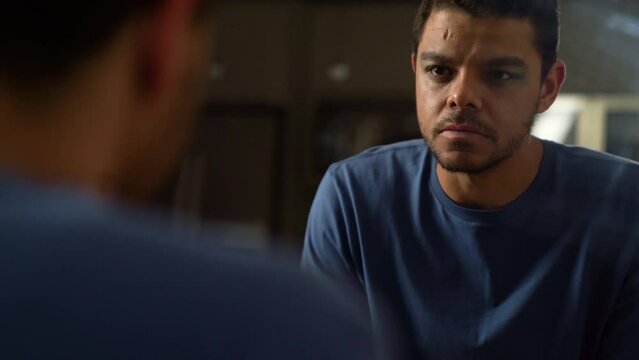 Latino Man Staring In The Mirror Looking Confident Dramatic Scene