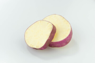 sliceds sweet potato slices over white background. fresh vegetable.