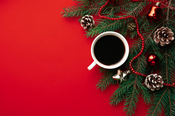 cup of coffee on red holidays background. Christmas mood background