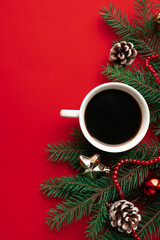 cup of coffee on red holidays background. Christmas mood background