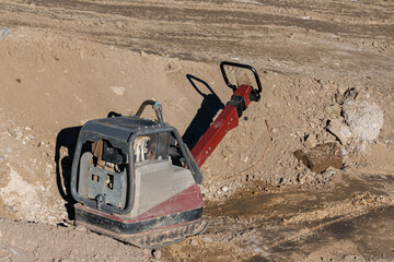 Manual diesel machine for compacting soil at a construction site