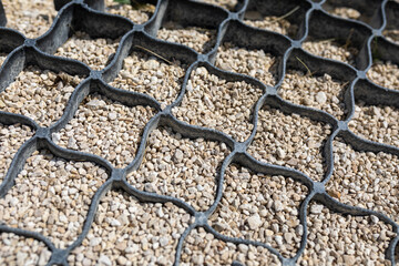 Geogrid. Geosynthetics, which is two-dimensional honeycomb structure made of strips of polyester...