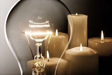 Energy concept. Glass bulb and candle