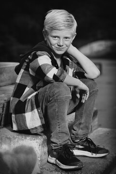 Young boy posing outdoor in skate park for monochrome book photos