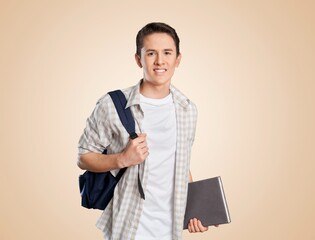 Young happy student posing with backpack