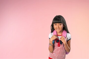 happy small girl with backpack ready for school