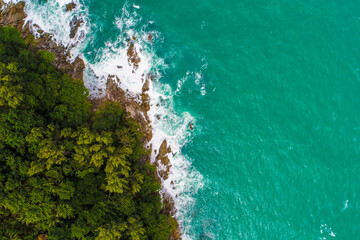 Aerial view green tree forest on sea island with sea wave beach