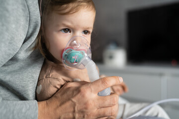 one child toddler girl using steam inhaler nebulizer at home - obrazy, fototapety, plakaty
