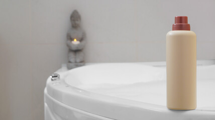Obraz na płótnie Canvas Beige bottle of bubble bath on tub indoors, space for text