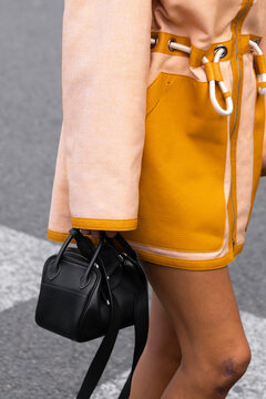 Paris, France - October, 1, 2022: woman wearing black Clemence mini Lindy 20 from Hermes, street style outfit details.