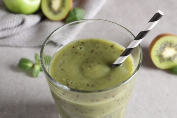 Delicious kiwi smoothie in glass, closeup view