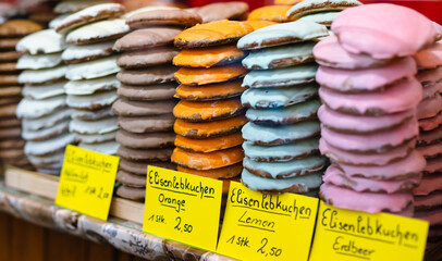 Colorful Nürnberger Elisenlebkuchen in assorted flavors, original gingerbread cookies, sold at Lebkuchen stall at Nuremberg Christkindlesmarkt, traditional and famous Christmas market in Germany - 550155347