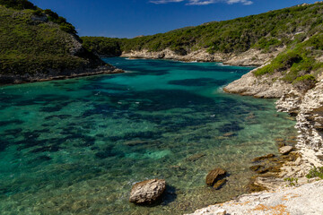 Natural landscape with mountain and blue sky, turquoise waters, eaux turquoises, lake, lac, paysage naturel avec montagnes et ciel bleu, Bonifacio, Corsica, Corse, France