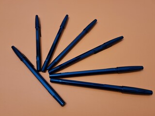 The office equipment used for writing is a black pen