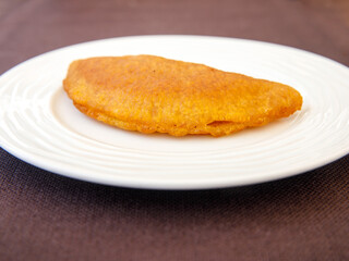 Traditional Turkish Dessert Tas Kadayif on white plate close up.