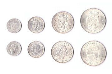 Old Dutch silver coins: half guilder coin, guilder (gulden), 2.5 guilders (rijksdaalder) and 10 guilder coin, depicting queen Wilhelmina and queen Juliana, front and back side, isolated on white