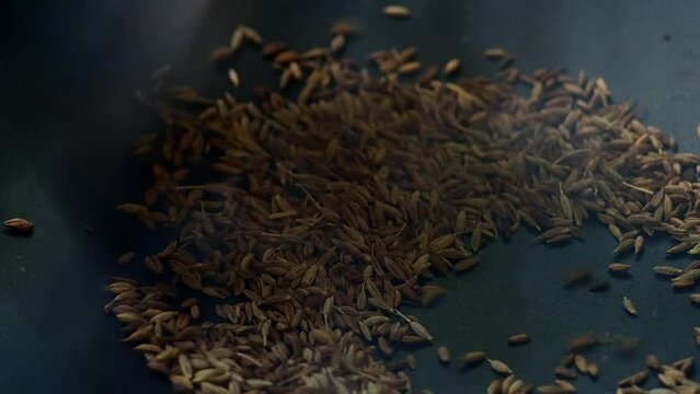 Frying caraway in pan, in door  Chiangmai Thailand