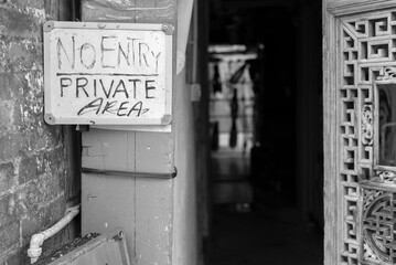 No entry or private area sign on an old building