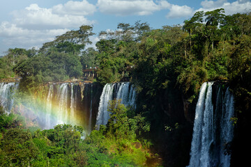 Naklejka premium Tourists walk across a platform at Iguazú Falls