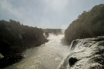 Stream of water in the Iguazu River after the fall of the Iguazu Falls seen from above