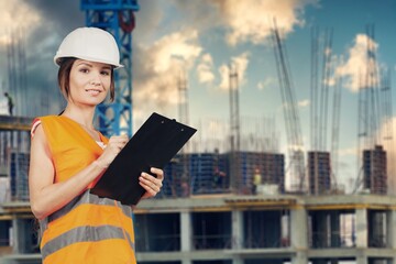 Young engineer on factory, checking up process