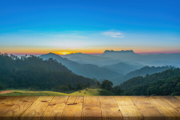 Selected focus empty wooden table and view of mountain blur background with bokeh image. for your...