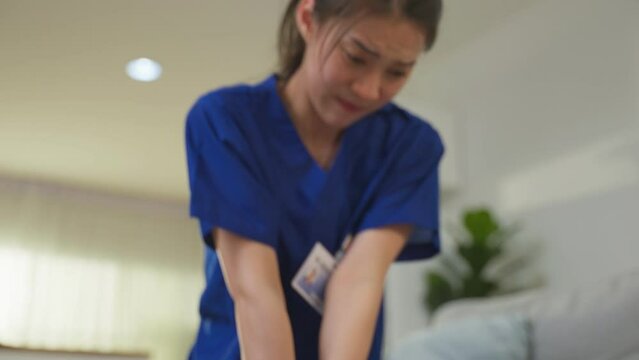 Asian caregiver saving senior woman's life by doing cpr in emergency. 