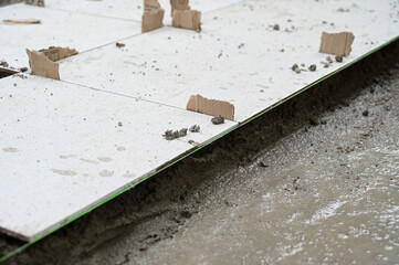 white tile and cement floor, construction industry