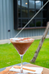 Chocolate milkshake in glasses of wine.