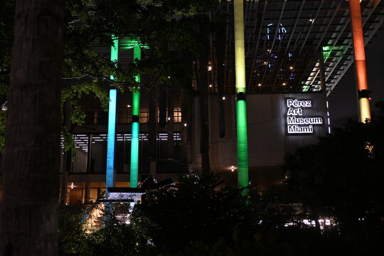 Perez Art Museum in Miami, FL in January 2022. Facade lit at night with different colors. Contempory art museum in downtown Miami