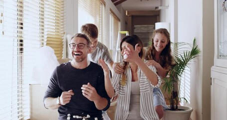 Home, property and happy family having fun while moving in, unpacking and bond in their new house together. Real estate, family and kids play with parents in celebration of dream home or relocation - Powered by Adobe
