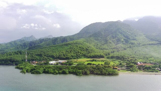 Aerial view of Java's north coast, Situbondo, East Java, Indonesia against the mountains. Travel footage
