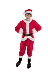 Full length portrait of a happy 10 year old boy dressed in a Santa suit and hat with hands on hips isolated on a white background