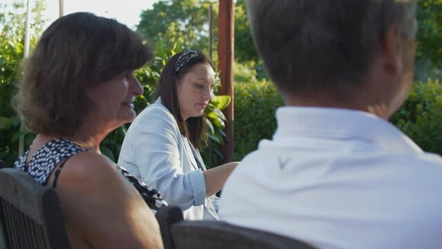 Outdoor summer gathering, Scandinavian family. Slow gimbal, shallow focus