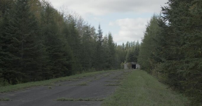The opening of an underground nuclear bunker is visible in a remote area of the former Loring Air Force base near Limestone, Maine.