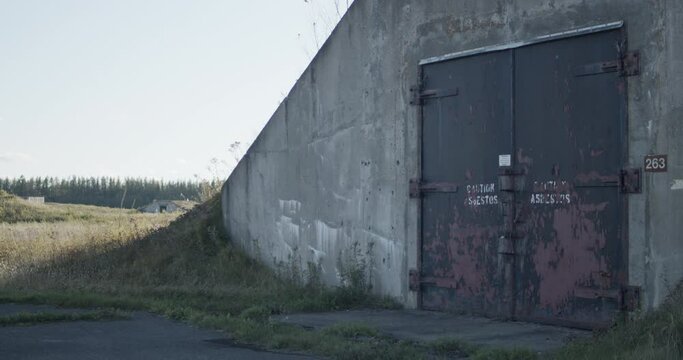 Closeup of steel blast doors of an underground nuclear bunker stand with another bunker visible in the backfround at the special security area of Loring Air Force base near Limestone, Maine.