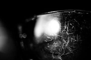 macro of the scratched surface of a polarized sunglasses lens