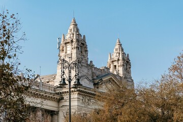 Exterior of Exchange palace with autumn trees under the clear sky in Budapest, Hungary
