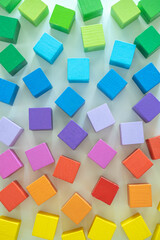 Rainbow spectrum Montessori material wooden bricks row imagination seamless pattern background