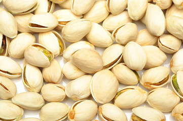 Many pistachio on white background 