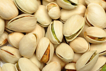 Many pistachio on white background 