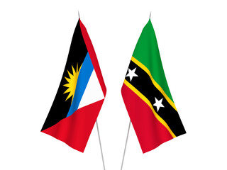 National fabric flags of Antigua and Barbuda and Federation of Saint Christopher and Nevis isolated on white background. 3d rendering illustration.