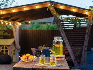 Drink station for an outdoor party. Abstract Night Festival in garden with bokeh for background usage.